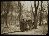 [Group of five women standing with cloaks, walking sticks and a banner that reads "Votes For Women Pilgrimage from New York City to Washington, DC 1913"]