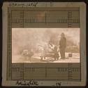 [Street paver beside smoking kettle]