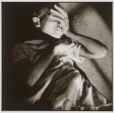 [A child lying on the floor in a sunbeam]