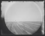 Truck approaching through mirage, two miles distant / seen through binoculars / Black Rock Playa, NV