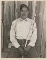 [Portrait of man with cane]