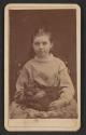 [Girl holding cat]