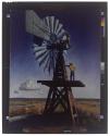 [Reproduction of a painting of a windmill on the American plains]