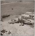 [Men working on boats on beach, Greece]