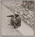 [Man begging on roadside]