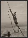 [Worker on cable, Empire State Building construction]