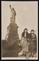 [Two women at the Statue of Liberty]