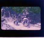 [Chapin & wife being carried up Tai Shan Mountain]
