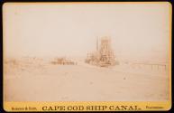 [Dredge equipment on beach]