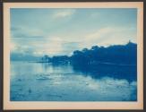 [Shore of lake with building in distance]
