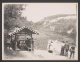 [Group by wooden pavilion next to gorge]