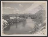 [River flowing past town]