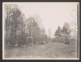 [Wooden benches and swings in park]