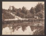 [Stairs leading down to pond]
