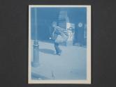 [Old man carrying bundle of rags]