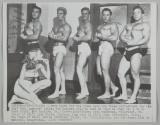 A rare sight for the young lady are these contestants for the 1947 "Mr. America" title