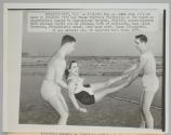 Why go south when it's so warm in Atlantic City say these visitors frolicking on the beach as temperatures soared to near-summer heights