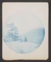 [Woman and man seated on mountaintop]