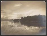 [Shore of lake with building in distance]