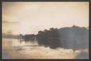 [Shore of lake with building in distance]