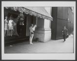 [Woman reading newspaper]