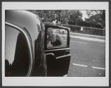[Woman entering cab in London]