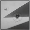 [Close-up of aircraft with circular metal shape on surface]