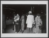 [African American woman in black and white striped fur coat]