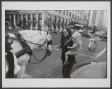[Woman and child petting a horse]