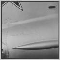 [Close-up of aircraft, possibly fuselage, with partially cropped star]