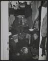 [Tenants share a room in a tenement building, likely Hong Kong]