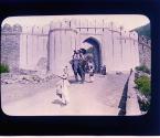 Where Citizens Enjoy the Rights of Royalty. Until recently, when an excellent carriage road was completed... the Maharajah furnished elephants from his private stables to his guests for the ride to Amber of whose outer gates is here shown
