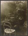 [Chairs and a ball in a home garden]