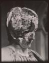 [Inside of a broken statue shaped like a human head]