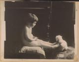 [Child and white fluffy creature]