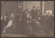 [Group of men in a cafe]