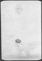 [Person parachuting]