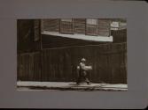 People Walking Against Building